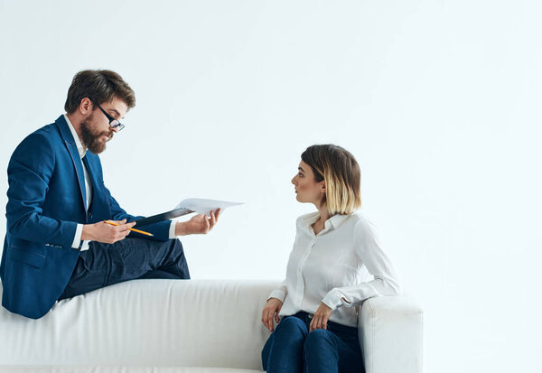 man in suit next to woman businessmen team communicating emotions