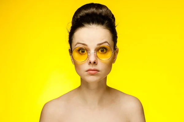 Sexy brunette naked shoulders fashion glasses cropped view studio — Stock Photo, Image