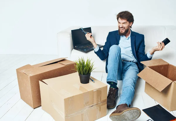 Business man boxes with things laptop office unpacking work