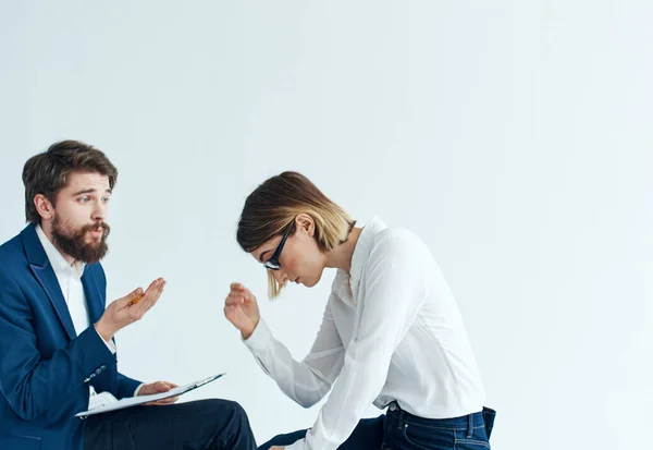 Business men and women sit on the couch communicating employees psychology