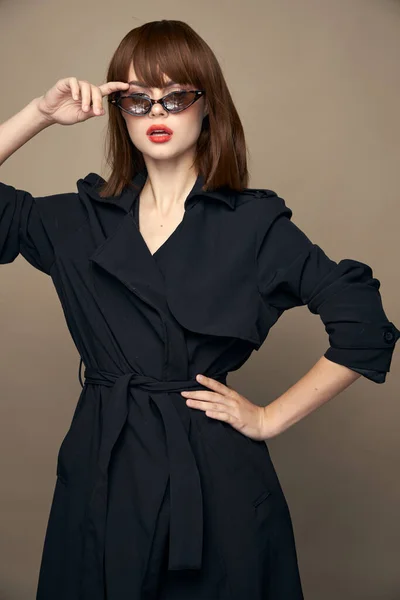 Sexy woman touches face with his hand dark glasses isolated background — 스톡 사진