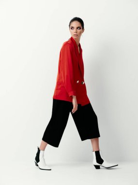 brunette in red jacket fashion makeup on face clothing advertisement