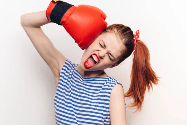 Woman in striped t-shirt red boxing glove emotions toning — Stock Photo, Image