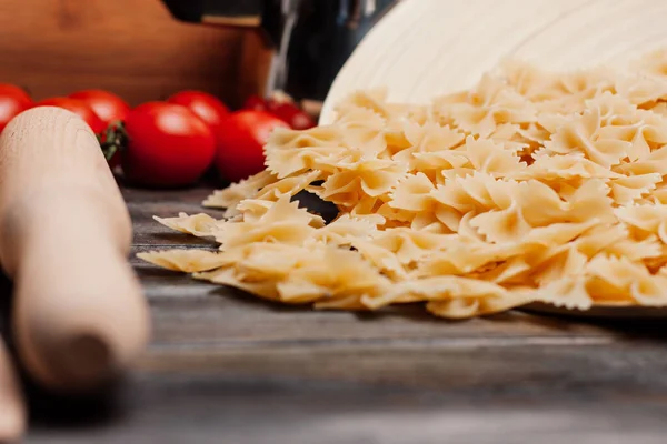 Italian pasta cherry tomatoes cooking italian foods — стокове фото