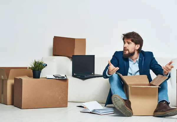 Business man getting laid off packing things manager