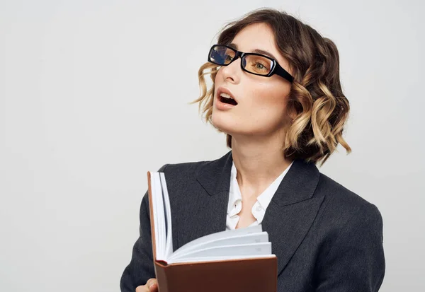 Business woman in classic suit brown book cropped view — Stock Photo, Image