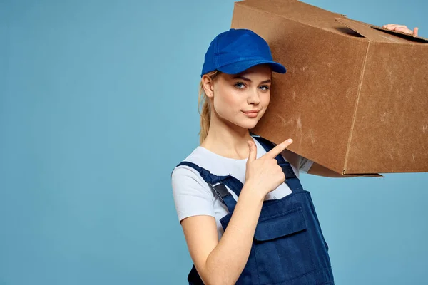 Woman with box in hands delivery service professionals blue background