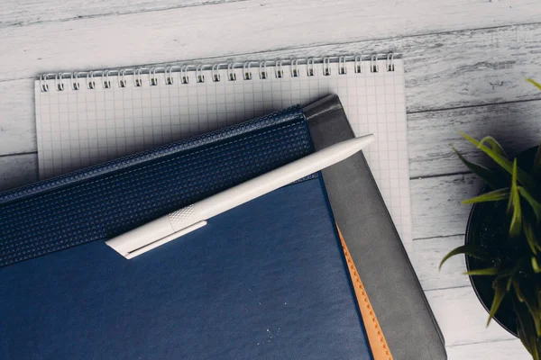 notepads documents desktop office close-up pen objects from above