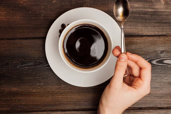 Xícara de café em uma mesa de madeira doces café da manhã vista superior — Fotografia de Stock