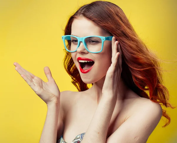 Joyful woman with bright makeup on a yellow background and naked shoulders model — Stock Photo, Image