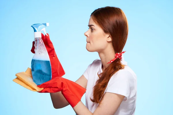 Professional cleaning lady cleaning supplies home service blue background — Stock Photo, Image