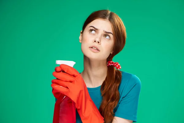 Emotional woman detergent service housework green background — Stock Photo, Image