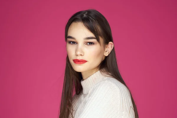 stock image Woman with long hair and red lips white blouse pink background attractive look