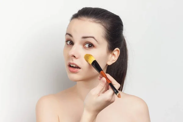 Brunette cream face mask bare shoulders cropped view — Stock Photo, Image