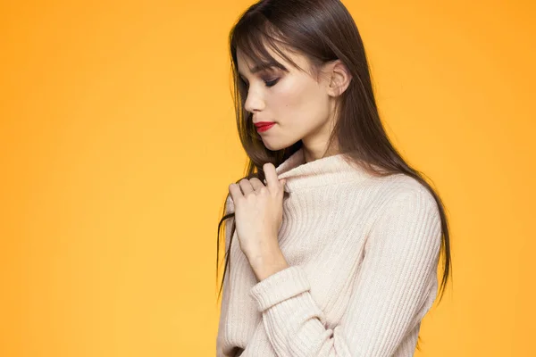 Cute brunette red lips fashionable clothes studio yellow background