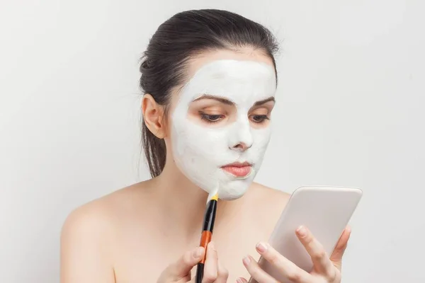 pretty brunette brush face mask skin care health