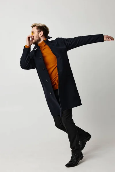 Man black coat movement dance fashion modern style isolated background — Stock Photo, Image
