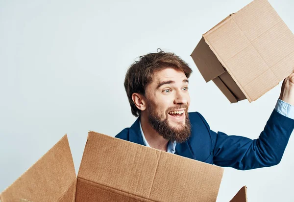 man with boxes in groups moving new place of work lifestyle official