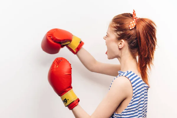 Aggressive woman doing sports boxing striped t-shirt hairstyle model — Stock Photo, Image