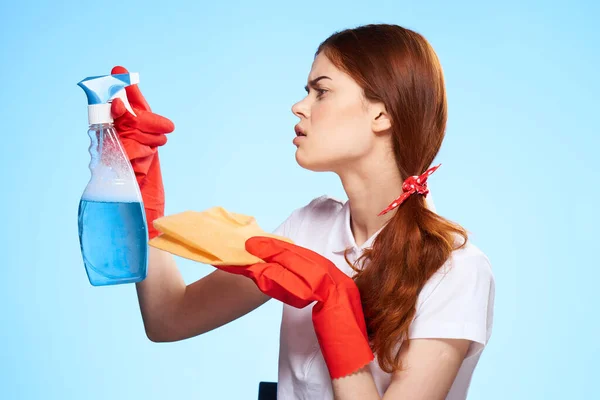 Professional cleaning lady cleaning supplies home service blue background — Stock Photo, Image