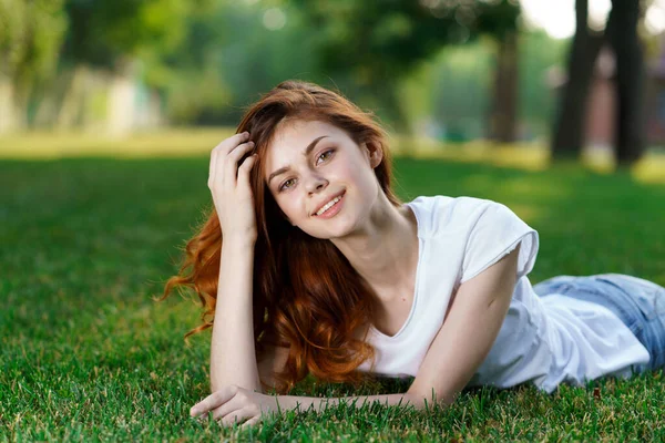 Pretty woman lying on the lawn rest charm fresh air — Stock Photo, Image