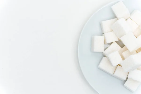 Sucre raffiné sur une assiette calories bonbons — Photo