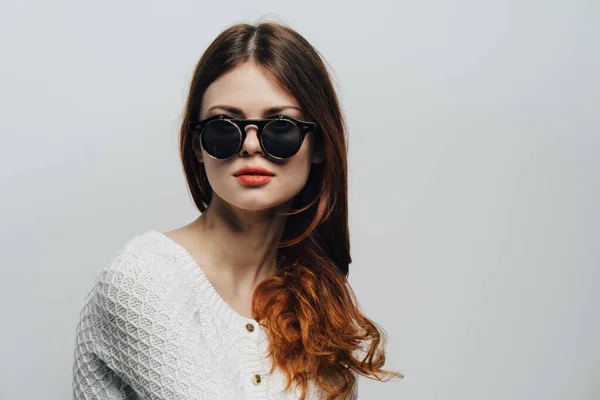 attractive woman wearing sunglasses loose hair studio fashion close-up