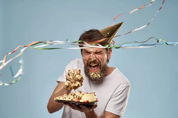 Cheerful man cake birthday celebration blue background