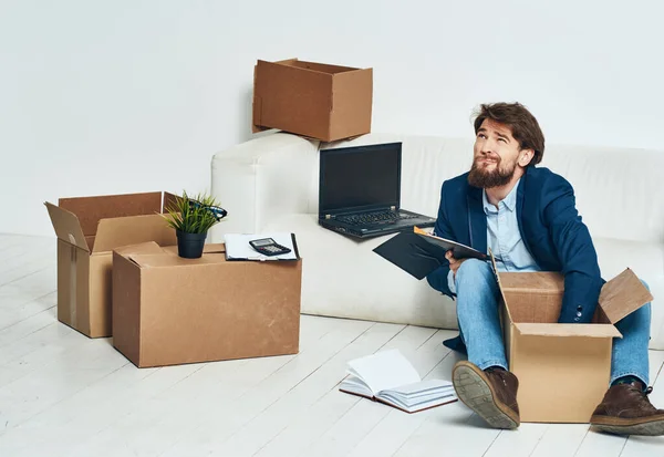 Business man getting laid off packing things manager