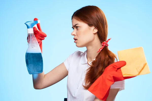 Professional cleaning lady cleaning supplies home service blue background — Stock Photo, Image