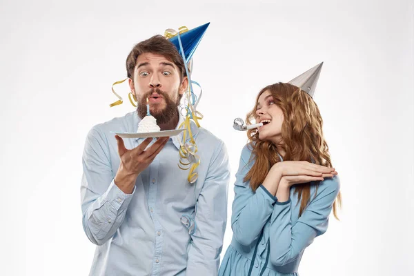 Joyful man and cheerful Woman holiday cake Birthday cap party corporate party young people — Stock Photo, Image