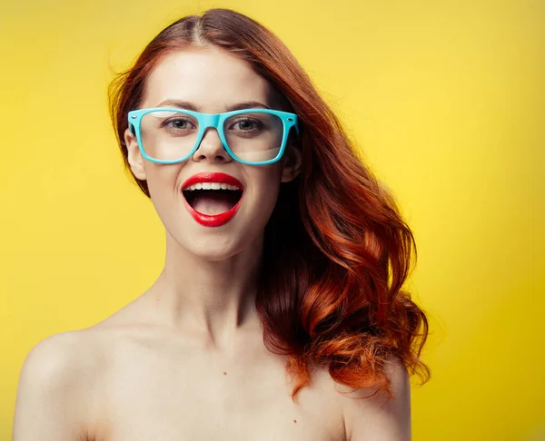 Attractive woman with bare shoulders blue glasses red hair cropped view — Stock Photo, Image