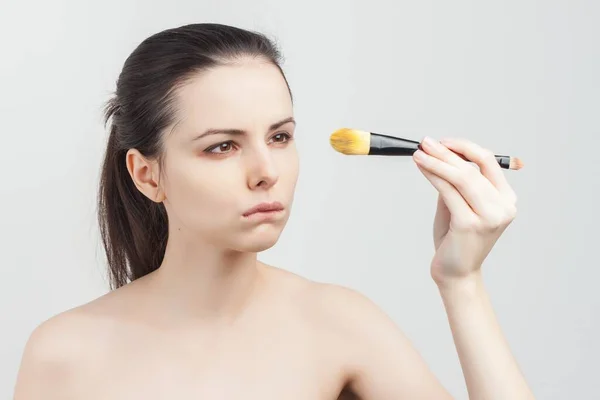 Brunette with bare shoulders skin care cream cosmetics hygiene — Stock Photo, Image