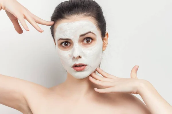 Brunette with bare shoulders skin care cream cosmetics hygiene — Stock Photo, Image