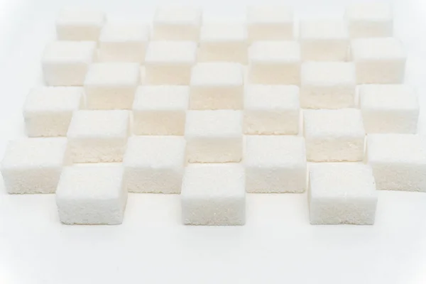 Sugar cubes staggered Glucose refined food ingredient — Stock Photo, Image