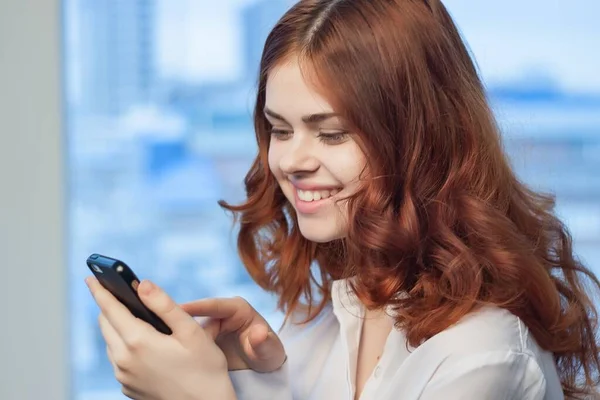 Pretty woman in shirt with phone in hand communication Office professional — Stock Photo, Image