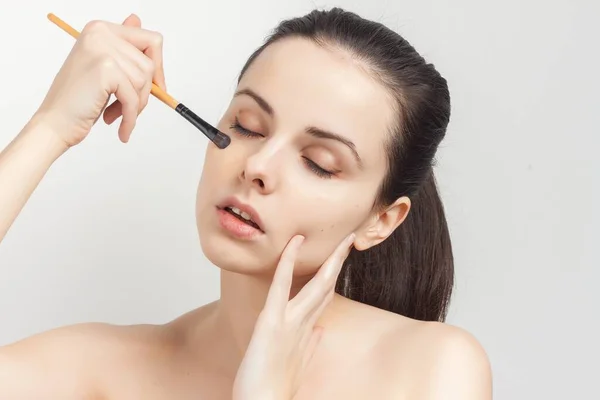 Attractive woman with bare shoulders applying makeup skin care — Stock Photo, Image