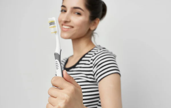 Cheerful woman in striped t-shirt toothbrush hygiene — Stock Photo, Image