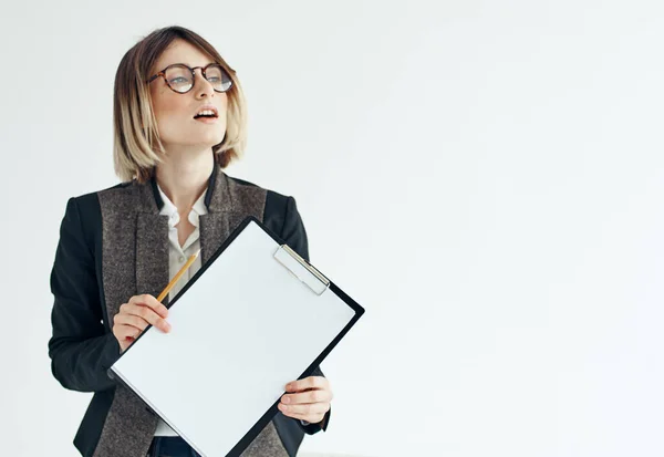 Business woman in a jacket manager model glasses and a white sheet of paper — Stock Photo, Image