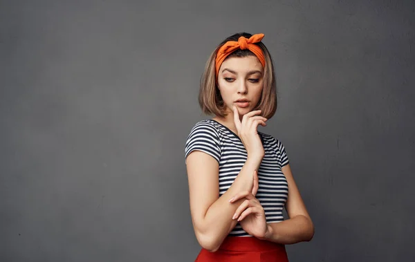 pretty woman in striped t-shirt bandage orange on her head fashion emotions