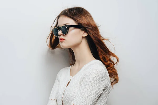 Attractive woman fashion glasses white sweater cropped view studio — Stock Photo, Image