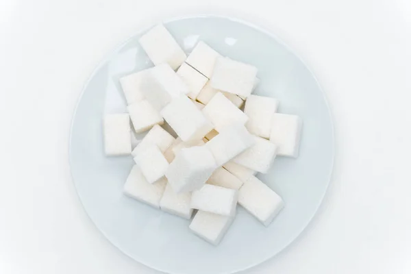 Geraffineerde suiker op een bord calorieën snoep — Stockfoto