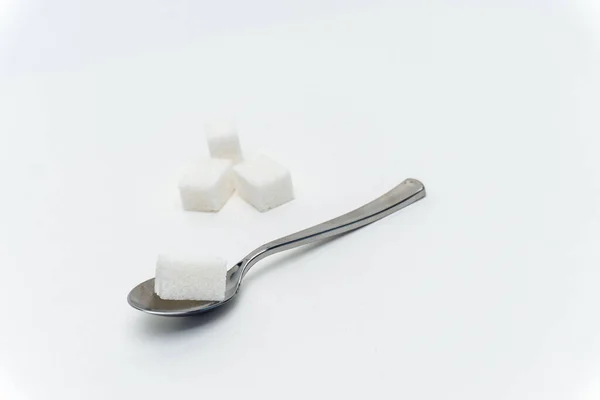 Sugar cubes in a teaspoon sweets calorie ingredient Glucose — Stock Photo, Image