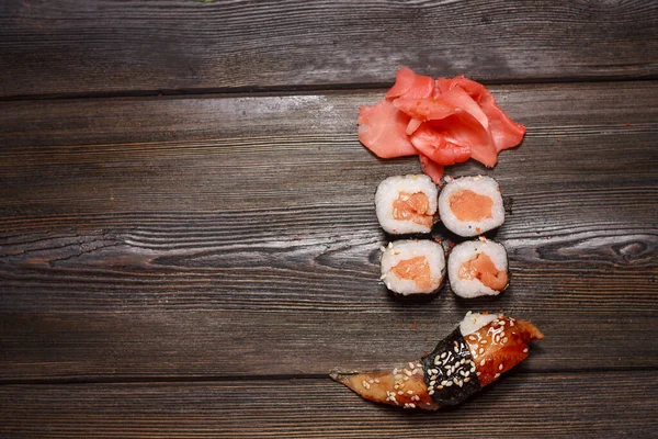 Sushi chopsticks rolls snack delicacy japanese cuisine gourmet — Stock Photo, Image