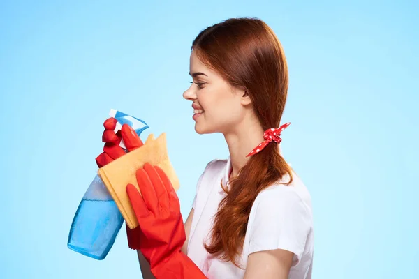 Professional cleaning lady cleaning supplies home service blue background — Stock Photo, Image