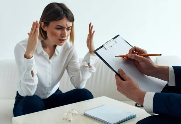 Employees men and women at the table communicating psychologist documents