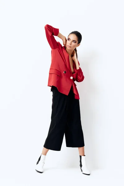 Pretty woman in fashionable clothes red blazer cosmetics — Stockfoto