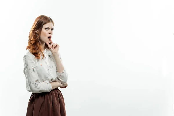 Pretty elegant woman in suit stimulates with hand studio — Stock Photo, Image