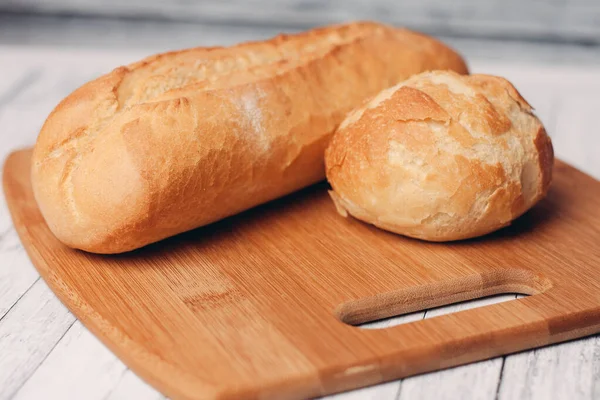 stock image loaf with bun fresh baked goods home cooking wood board fresh flavor