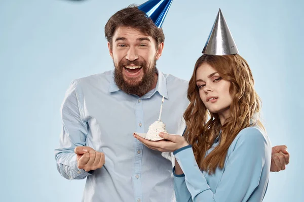 Birthday corporate young man and woman with cake on isolated background disco party